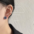 Gold Tone Blue Five Petal Flower And Red Center Stud Earrings view 2
