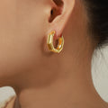 Gold Hexagon Huggie Hoop Earrings Faceted Geometric Frame view 3