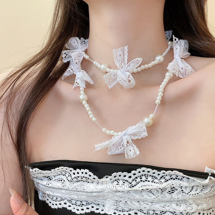 White Lace Bow and Faux Pearl Necklace with Decorative Details