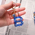 Blue Shell Resin Letter Keychain with Evil Eye Charm view 3