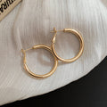 Polished Metal Teardrop Hoop Earrings in Six Size and Color Options view 8