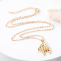 Gold Tone Sculpted Hand, Foot and Ear Pendant Necklaces view 2