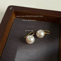 Gold Tone Hook Earrings With White Pearl Drops In Three Sizes view 6