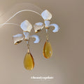 White Enamel Flower Stud Earrings With Yellow Drops view 2