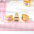 Gold Tone Wide Cuff Evil Eye Adjustable Rings in Eight Colors view 4