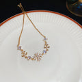 Snowflake Cross And Pearl Like Crystal Bracelets In Gold Or Silver view 7