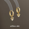 Gold Tone Crystal Pave Huggie Hoop Earrings Bow Drop view 3