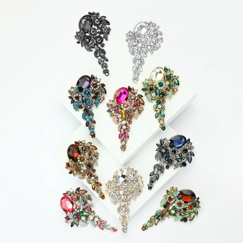 Angled view showing the crystal floral spray brooch surface