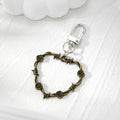 Barbed Wire Rose Heart Earrings and Clip Keychains in Three Finishes view 7