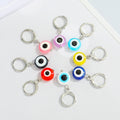 Silver Tone Round Evil Eye Huggie Drop Earrings in Eight Colors view 5