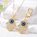 Gold and Silver Tone Crystal Hamsa Evil Eye Necklaces and Keychains view 1