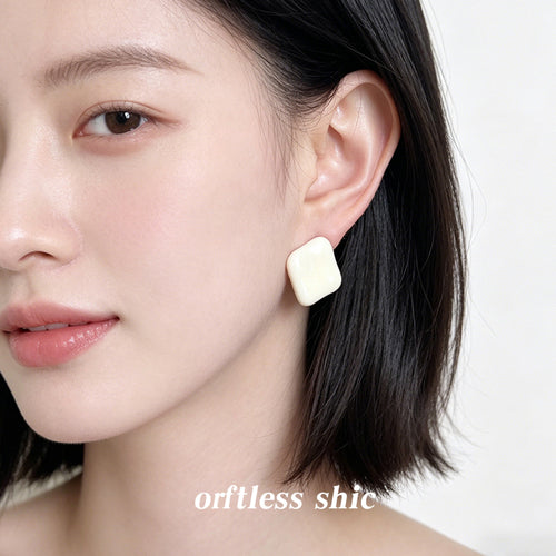 Cream square cushion stud worn on ear side profile