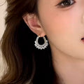 Gold Tone Twisted Hoop Earrings With Crystal Pearl Rows view 4