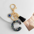Shell-Chip Resin Letter Keychain with Evil Eye Charm and Tassel view 4