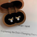 Gold Mini Bow Stud Earrings Clear CZ White Pearl Drop view 3
