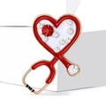 Heart Stethoscope Brooch In Metal With Colored Enamel, Floating Crystals, And A Crystal view 3