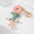 Gold Tone Woven Flower Doll Clip Keychains in Six Colors view 8