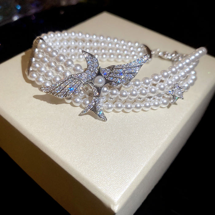 Multi Strand White Pearl Bracelet Silver Bird Zircon Charm