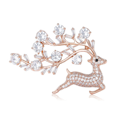 Yellow Gold Deer, Rose Gold Deer, Silver Deer brooch styles arranged on a light display