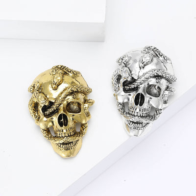 Antique Tone Skull Brooch with Rose Detail displayed from the front