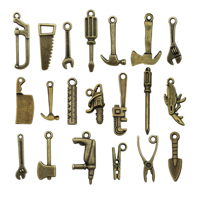 Gold-tone assorted shape charms arranged on a light background