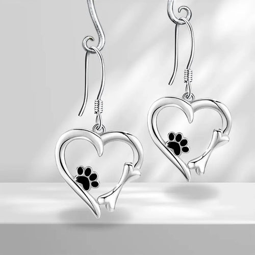 Product view showing silver-tone cat-tail heart and paw-print hook earrings