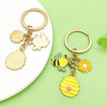 Bee and Honeycomb Charm Keychains Featuring Flower Across 33 Pictured Variations view 3