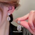 Silver Tone Clear Crystal Oval Drop Earrings in Two Designs view 2