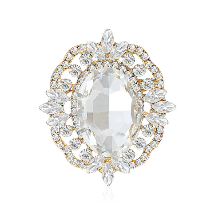 Oval Crystal Halo Brooch With Polished Metal And Sculpted Decorative Details