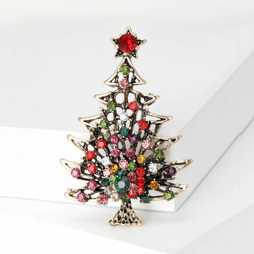 Christmas tree brooch on white blocks openwork metal multicolor stones