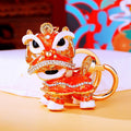 Gold Tone Lion Dance Keychains with Crystals and Braided Straps view 2