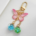 Pink Ombre Glitter Butterfly Keychain With Two Star Confetti Globes view 2