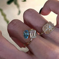 Gold Open Dual Stone Ring Blue Pear Clear Emerald Cut view 4