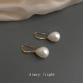 Gold Fishhook Teardrop White Iridescent Pearl Drop Earrings view 4