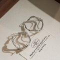 Irregular Wavy Hoop Earrings In Gold And Silver Tones view 6