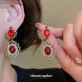 Red Oval Gem and Gold Tone Filigree Drop Stud Earrings view 2