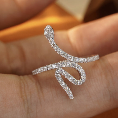 Front product view of silver tone curved snake open ring with clear stone surface