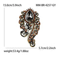 Ornate Teardrop Crystal Brooch with Filigree Scrolls view 8