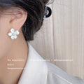 Ivory Five Petal Flower And White Pearl Center Stud Earrings view 2