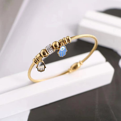 Close-up showing the colors and surface details of gold Tone Evil Eye Adjustable Cuff Bracelets in Three Styles