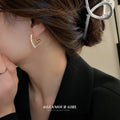 Open Heart Crystal Earrings and Floral Studs in Three Colors view 2