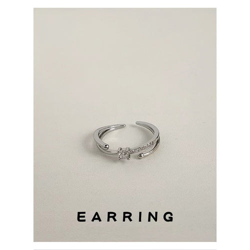Silver-tone multi-band clear-stone flower open ring displayed from the side.