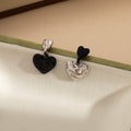 Mismatched Black and Silver Sculpted Heart Stud Earrings view 4