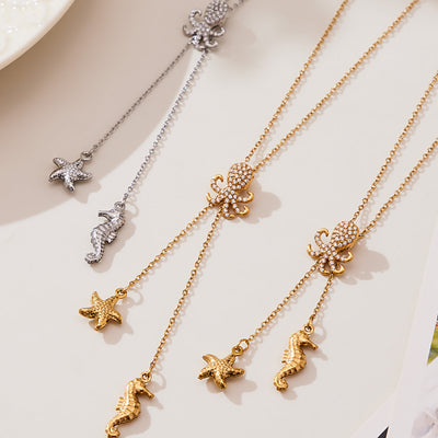 Grouped style view of crystal octopus starfish seahorse lariat necklaces in main image 1.