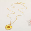 Gold Tone Round Pressed Daisy Resin Pendant Necklaces in Two Colors view 3