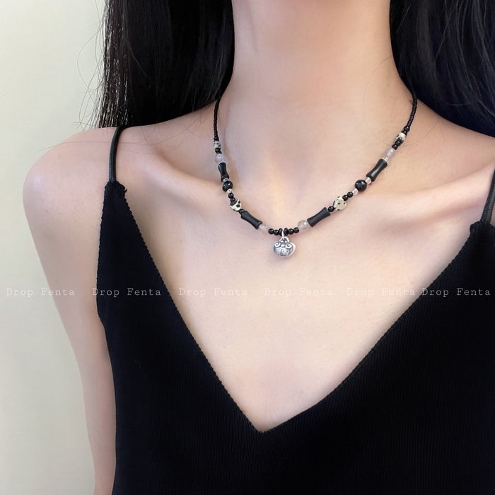 Black Beaded Necklace With Silver Tone Round Lock Pendant