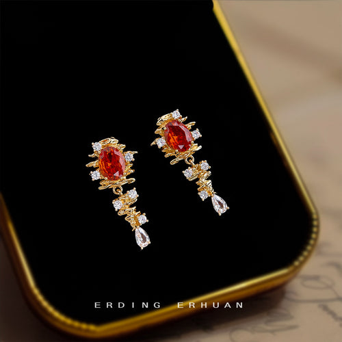 Orange CZ branch dangle earrings in black jewelry box
