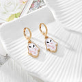 Gold Tone Pressed Flower Hamsa Huggie Earrings in Nine Options view 8