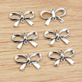 Open Bow Charms in Black, Gold, Silver, and Bronze Tones view 4