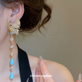 Phoenix and Blue Teardrop Tassel Earrings in Gold Tone view 3